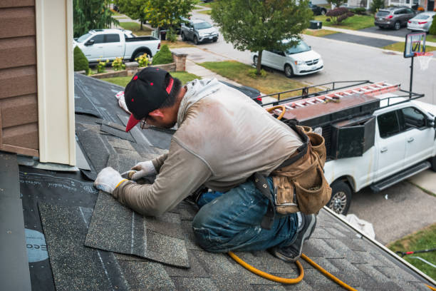 Professional Roofing technician working in East Rockaway, NY